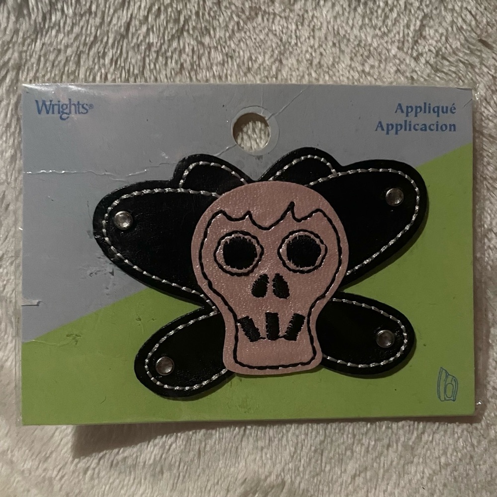 Pink and Black Skull Butterfly bling iron on patch
NWOT 2006
